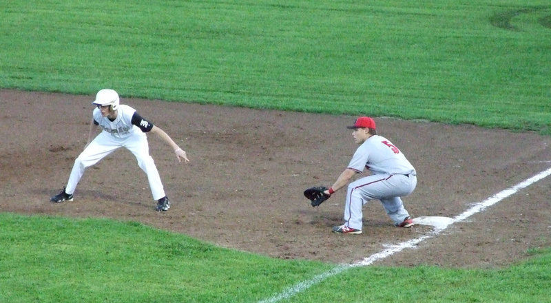Image: Alex DeMoss (#4), courtesy runner for catcher Ross Stiles, gets ready for the steal.