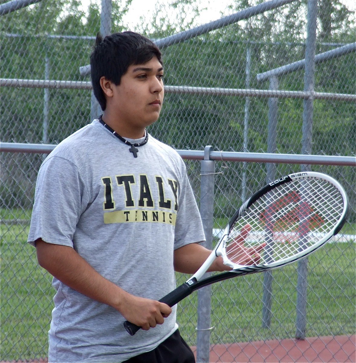 Image: Italy’s C.J. Enriquez gets set for his singles match in Rice.