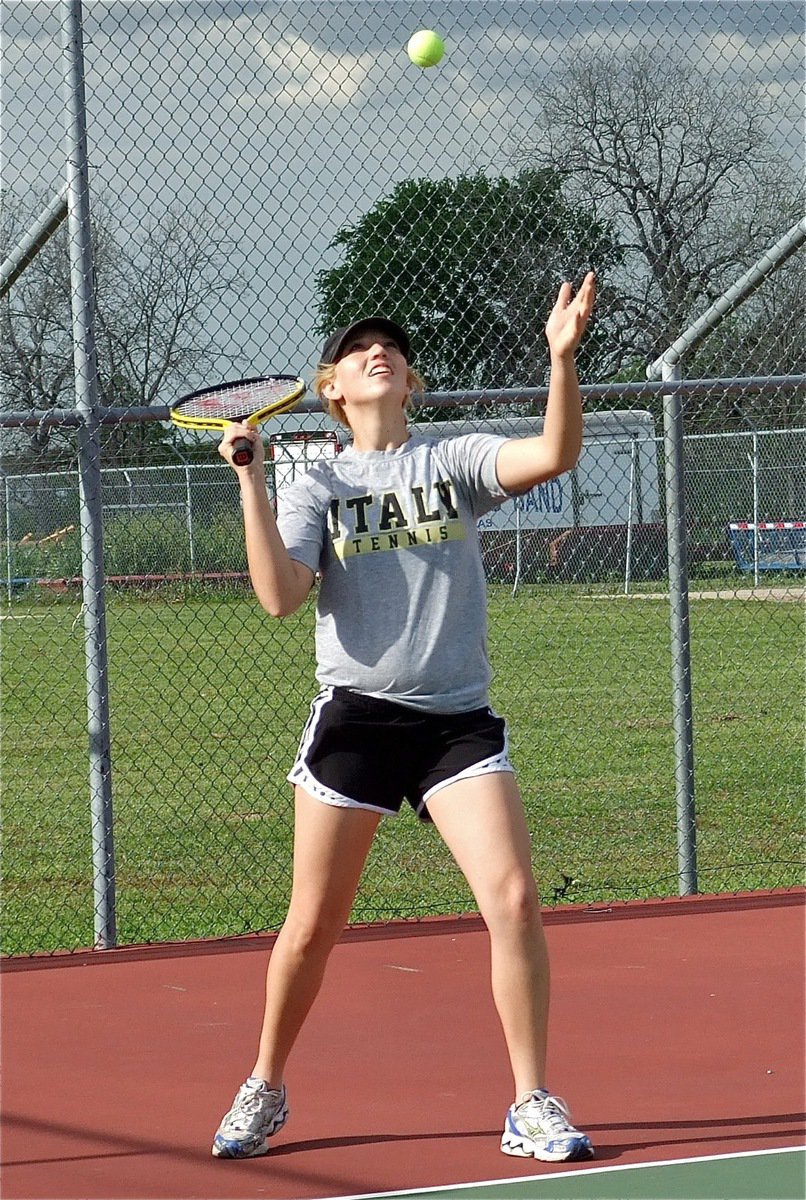 Image: Italy’s Megan Richards serves with a smile.