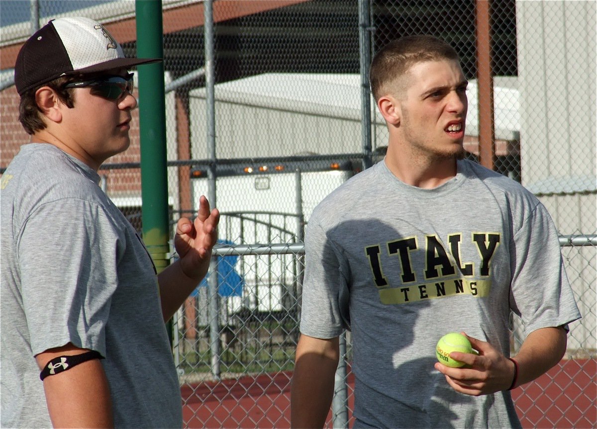 Image: Doubles partners Kevin Roldan and Brandon Souder ensure they’re on the same page with regard to their Rice Bulldog opponents.