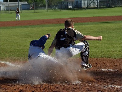Image: John Escamilla protects the plate and gets the out call.
