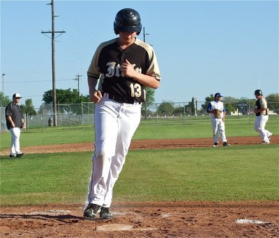 Image: Tyler Crawley scores for Italy off a bases loaded walk.