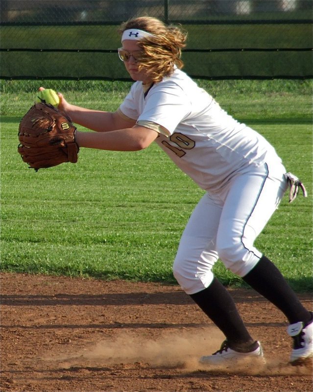 Image: Lady Gladiator Paige Wesbrook(10) fields a ground ball.