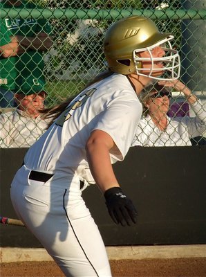 Image: Lady Gladiator, Madison Washington, gets ready to run after popping one up.