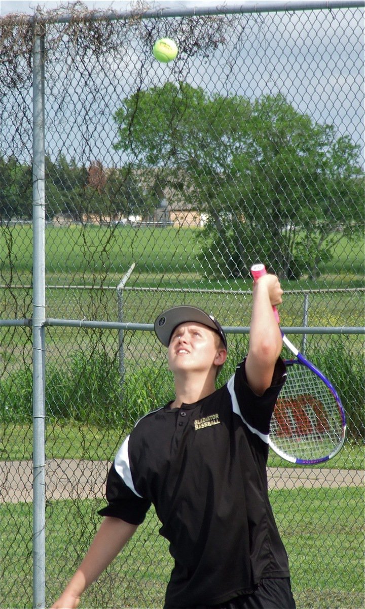 Image: Bailey Walton works on his overhead serve.