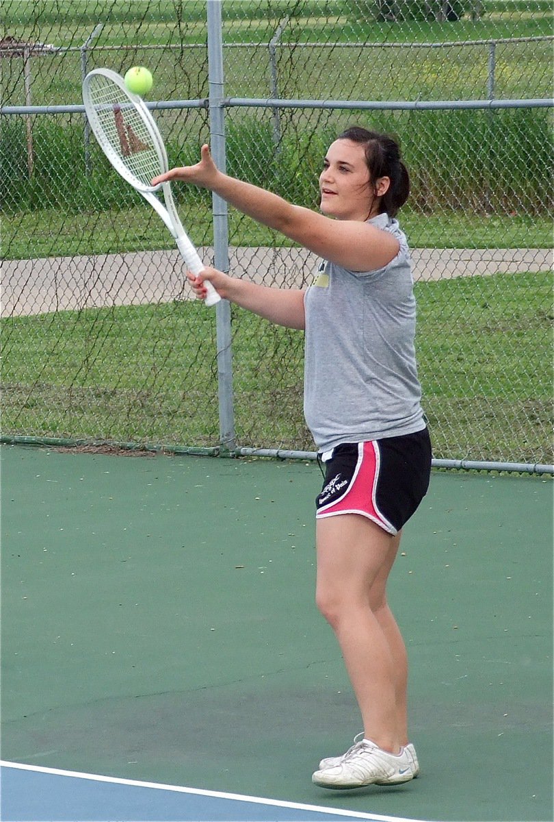 Image: Kaytlyn Bales prepares to serve during her singles match.