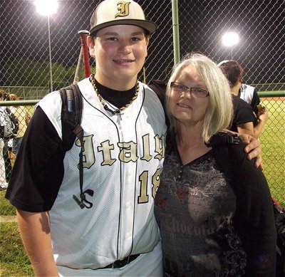 Image: Freshman hitting ace, John Byers(18) is congratulated by his former daycare teacher, Brenda McConnell, after Italy’s win over Rio Vista.