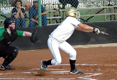 Image: Slap-hitter, Bailey Eubank(11) puts the ball between Lady Eagle defenders for a single.
