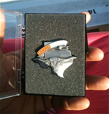 Image: Italy High School Senior, Jimesha Reed, displays the state silver medal won by IHS Freshman, Kortnei Johnson, with a time of 12.10 during the 2012 85th Clyde Littlefield Texas Relays (High Schools).