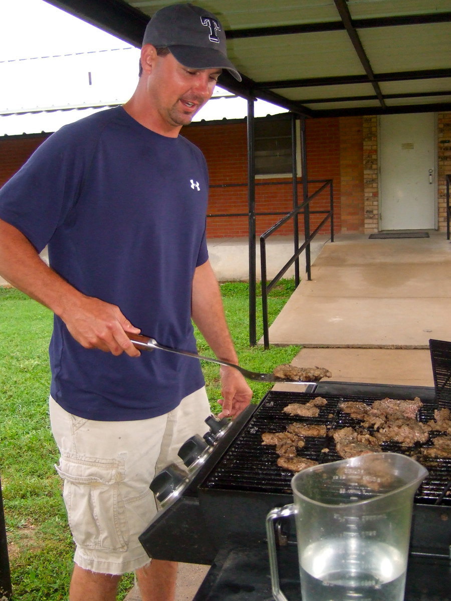 Image: Dennis Janek cooking for the kids.