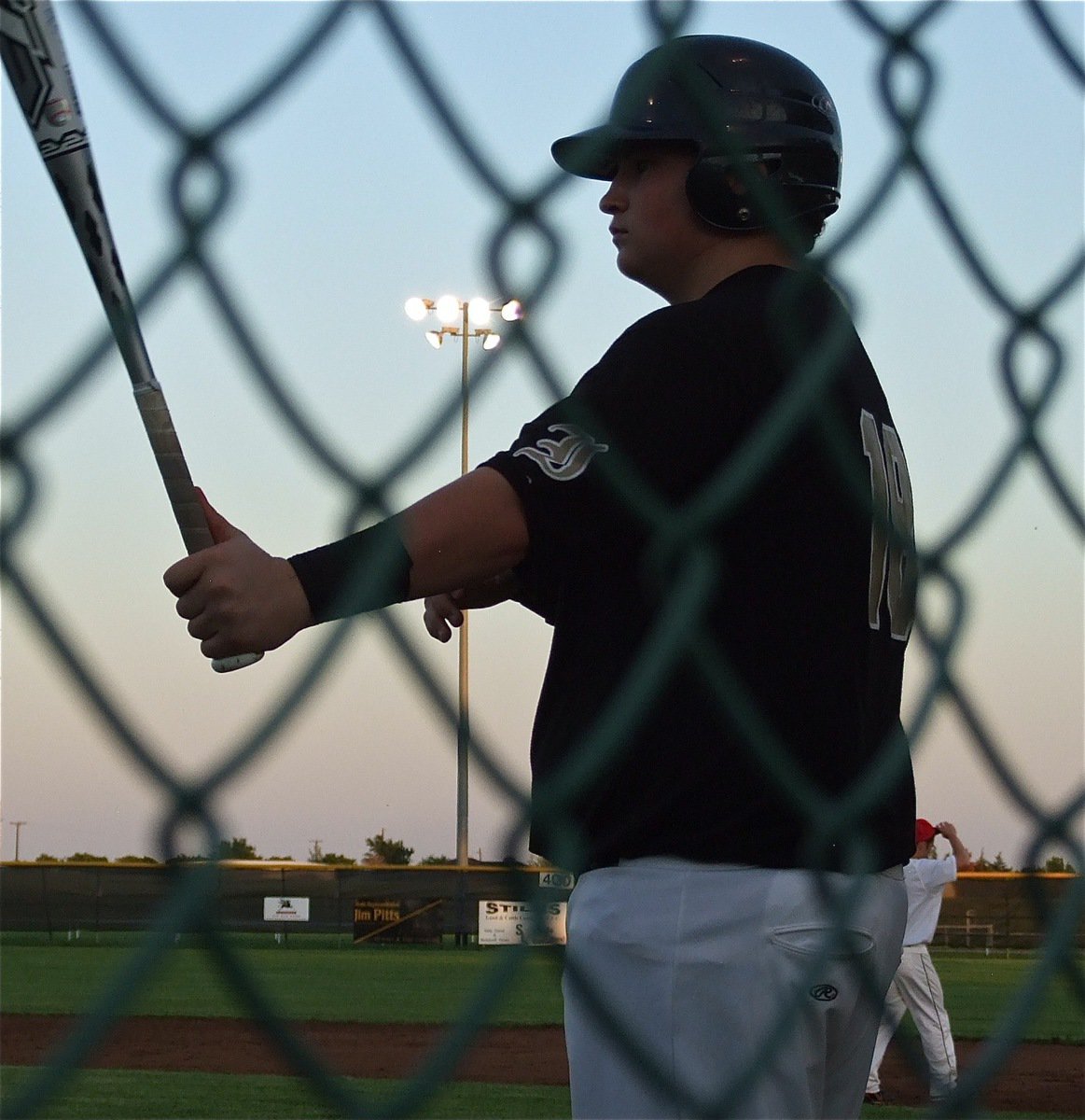 Image: Freshman Gladiator, John Byers warms up in the batter’s circle.