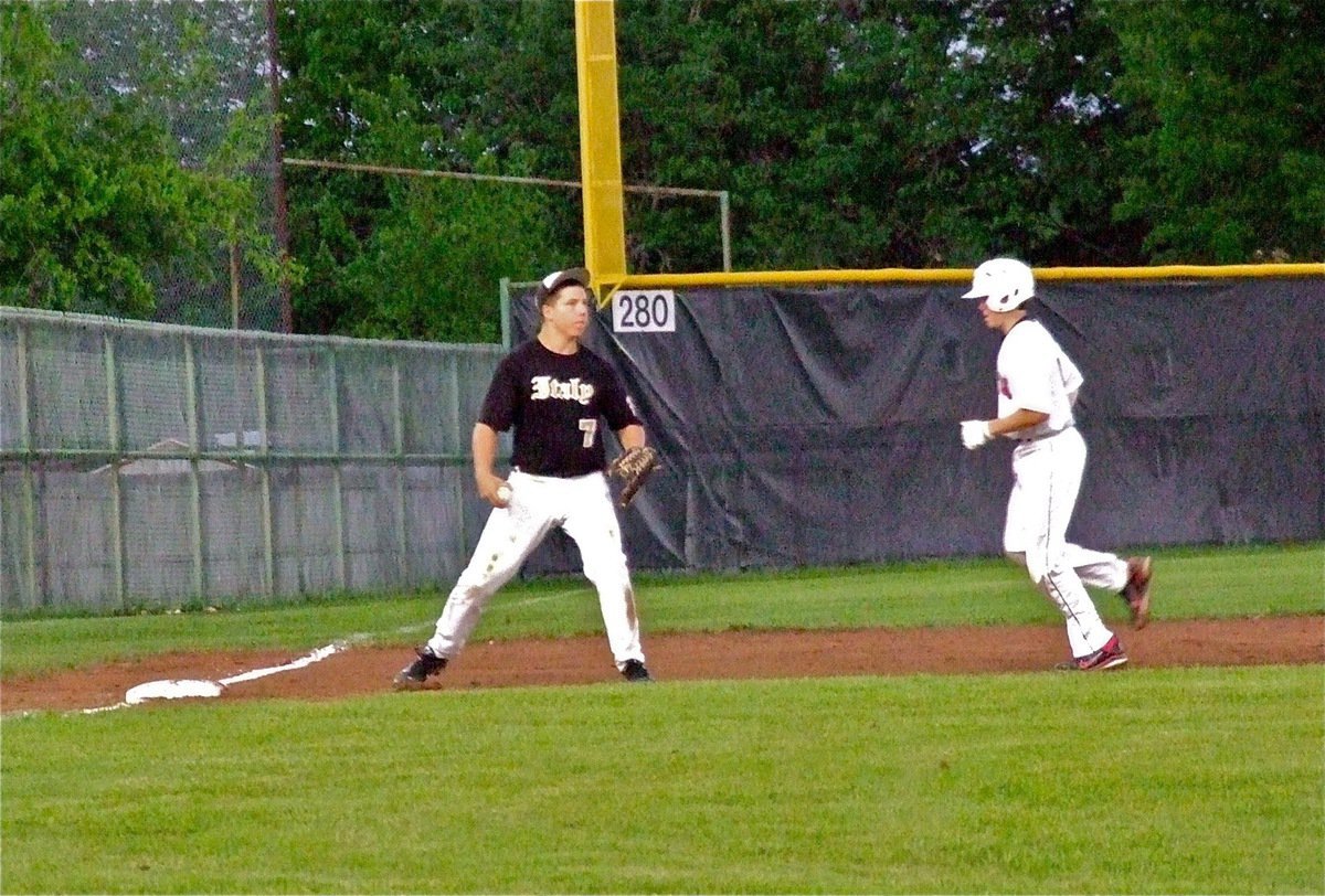 Image: Italy’s, Kyle Jackson(7) gets a force out at third base.