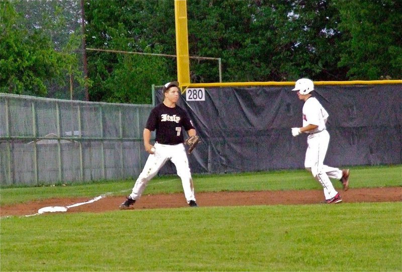 Image: Italy’s, Kyle Jackson(7) gets a force out at third base.