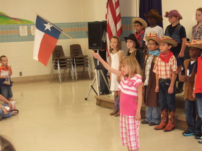 Image: These students are saying the pledge to the Texas flag.