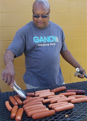 Image: Italy’s, Larry Mayberry, Sr. grills up some goodies before the game.