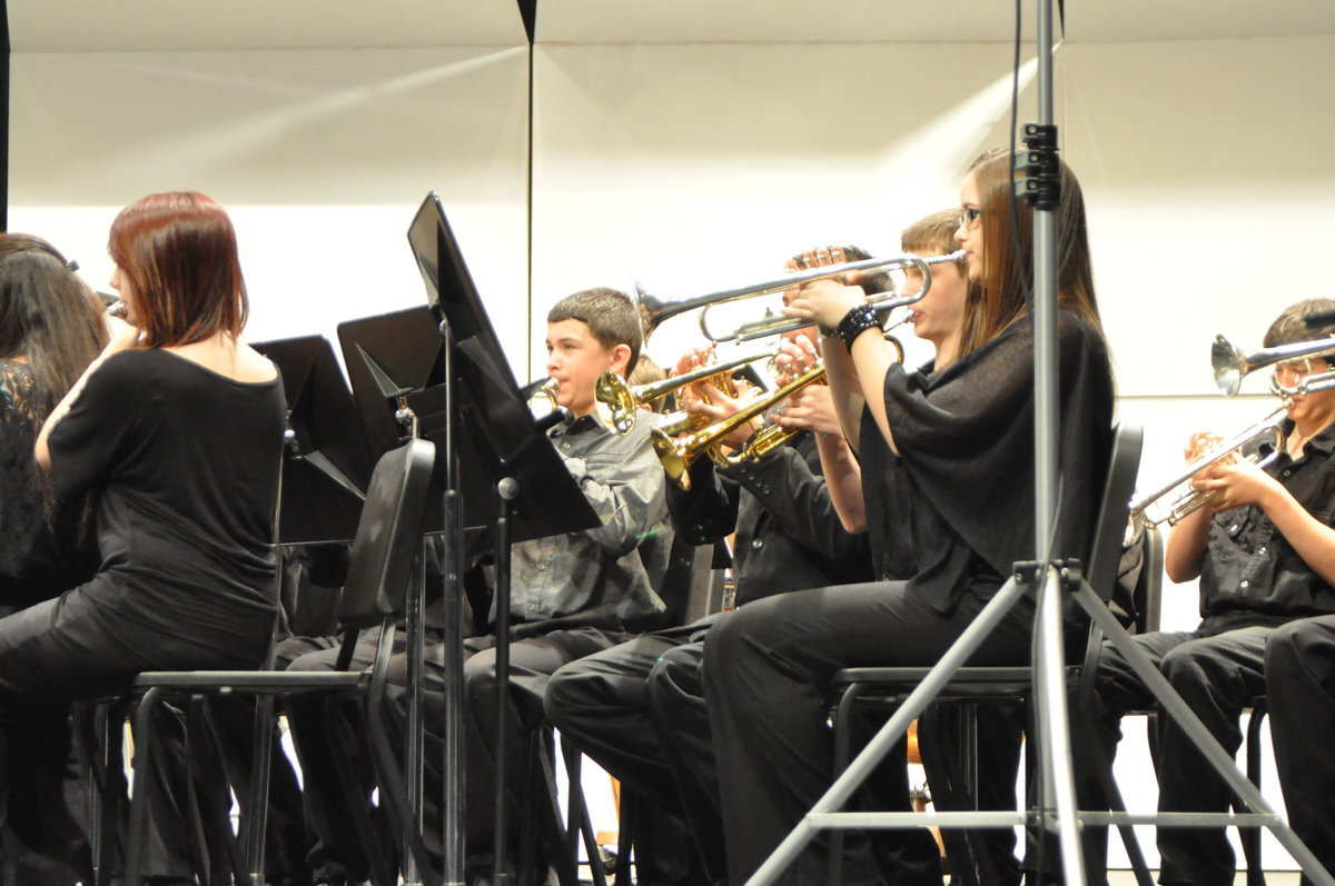 Image: Elijah Garcia, along with the other band members, works hard during the seven minute instruction period before the competition.