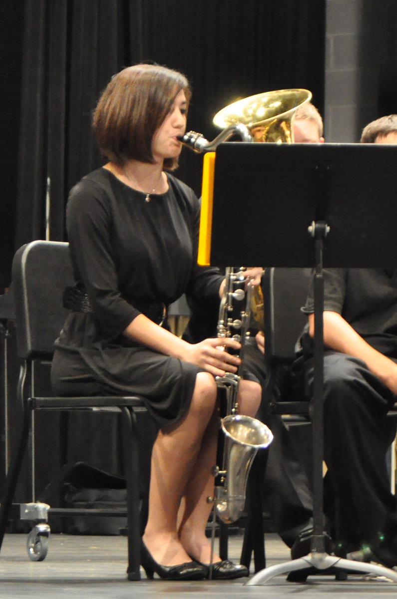 Image: Kaci Bales warming up on the bass clarinet.