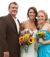 Image: Russ Lewis with his daughters Megann and Jaclynn at Megann’s wedding last spring.