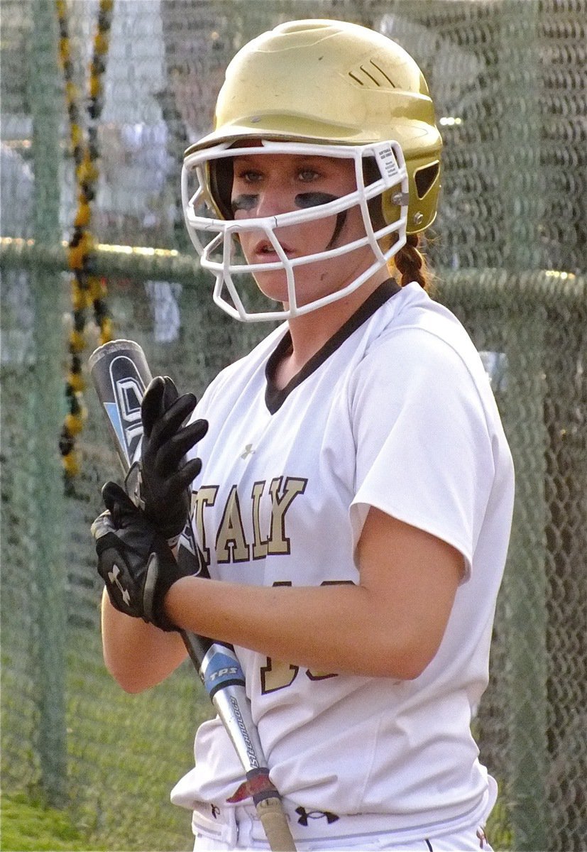 Image: Bailey Bumpus(18) gets gloved up and ready to bat.