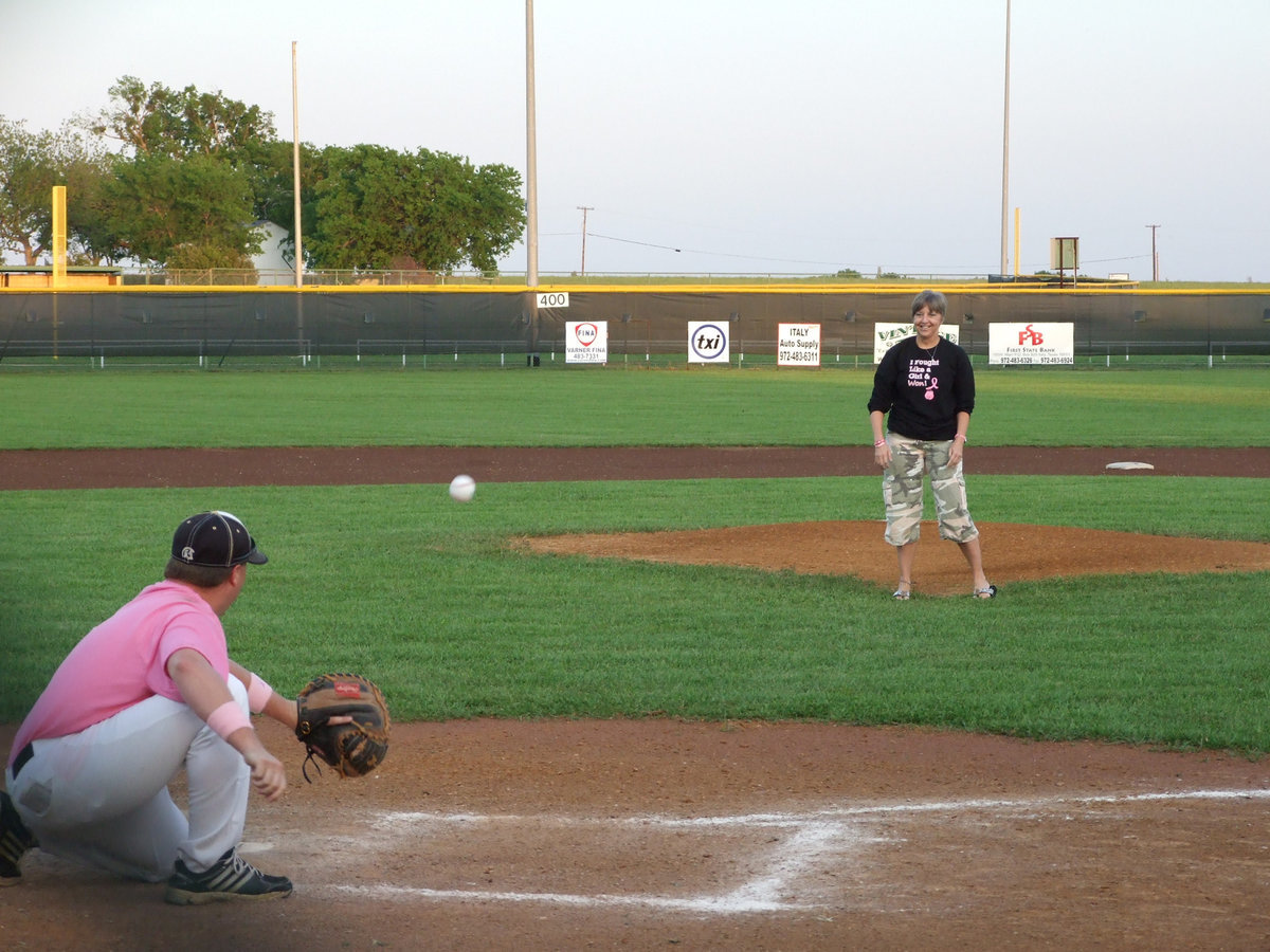 Image: Rhonda Ward throws the first pitch for the ballgame.