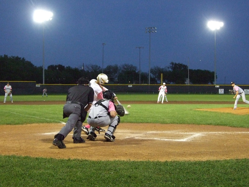 Image: Jase Holden(3) hits one to the outfield.