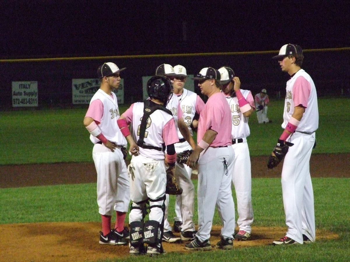 Image: Coach Ward talks to the infield.