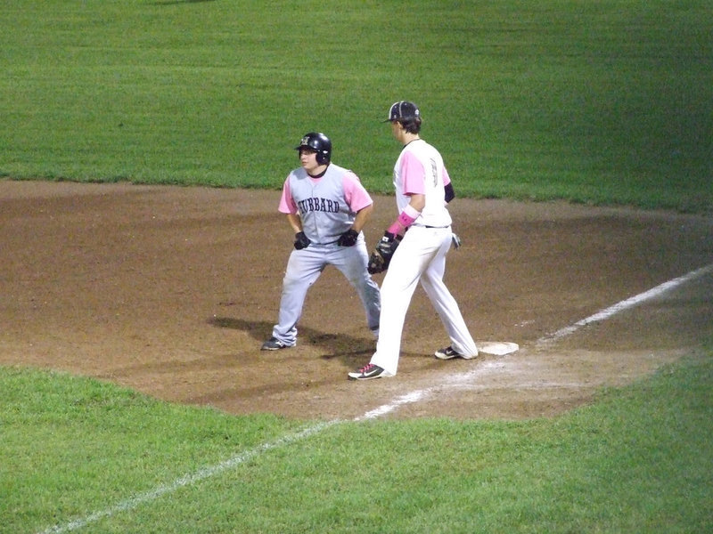 Image: Cole Hopkins(9) covers first base.