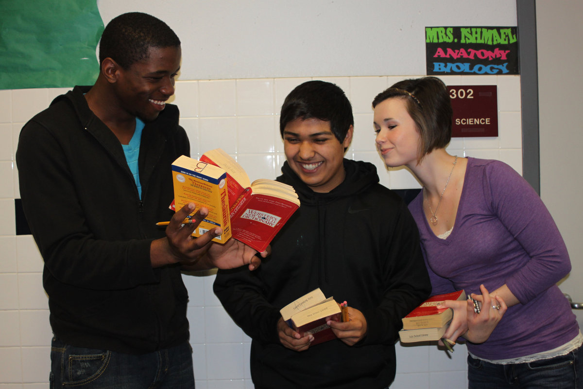 Image: Paul, Cruz and Meagan brush up on vocabulary words before their event.