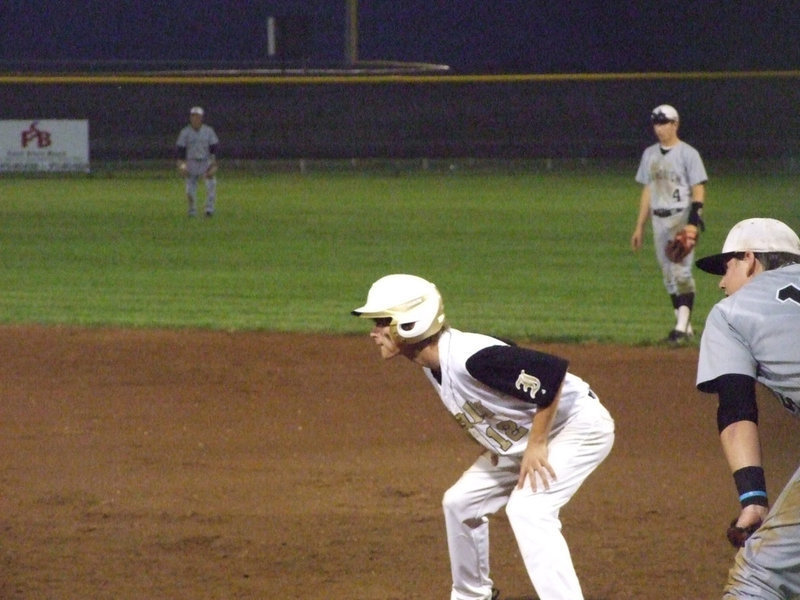 Image: Justin Wood takes his chances on first base.