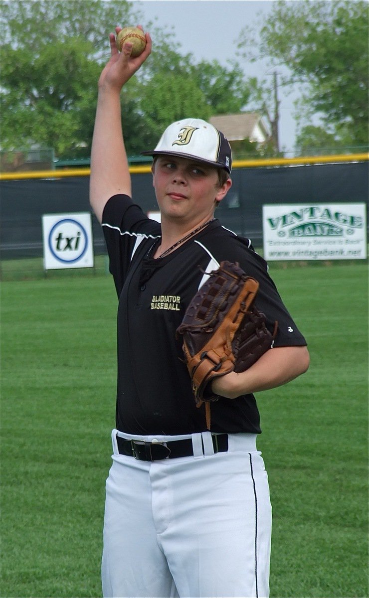 Image: JV Gladiator freshman, Tyler Crawley warms up before Italy’s game with Grandview.