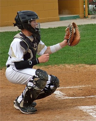 Image: Italy’s catcher, John Escamilla, hauls in a strike from his pitcher Tyler Anderson.