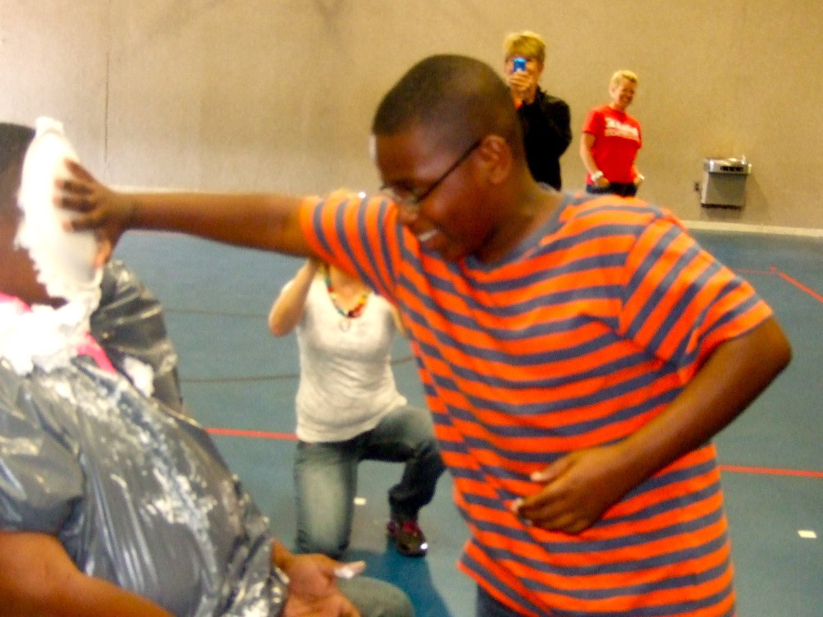 Image: Adam Powell rubs the pie in Mr. Miller’s face.