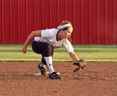 Image: Catcher, Alyssa Richards, put the ball on the money to shortstop, Bailey Bumpus, during a practice throw down.