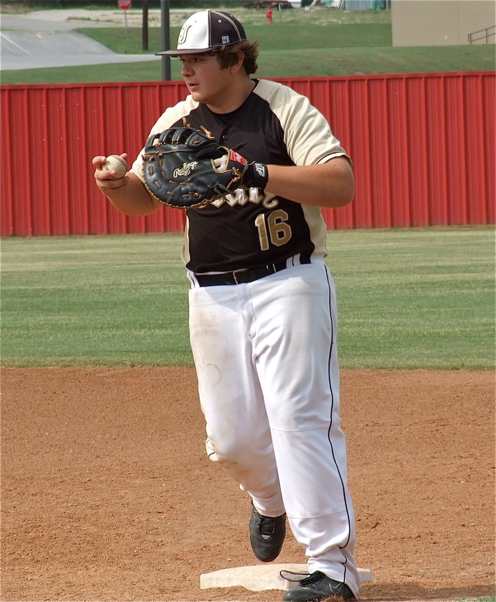 Image: Italy’s, Kevin Roldan(16), covers a grounder and tags his base for an out.