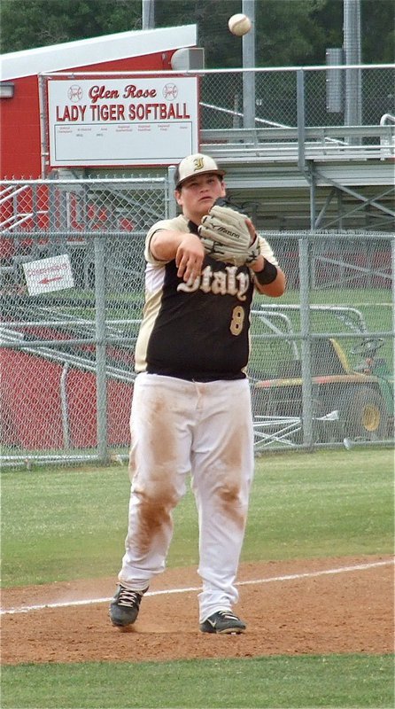 Image: John Byers(8), gets warmed up at third.