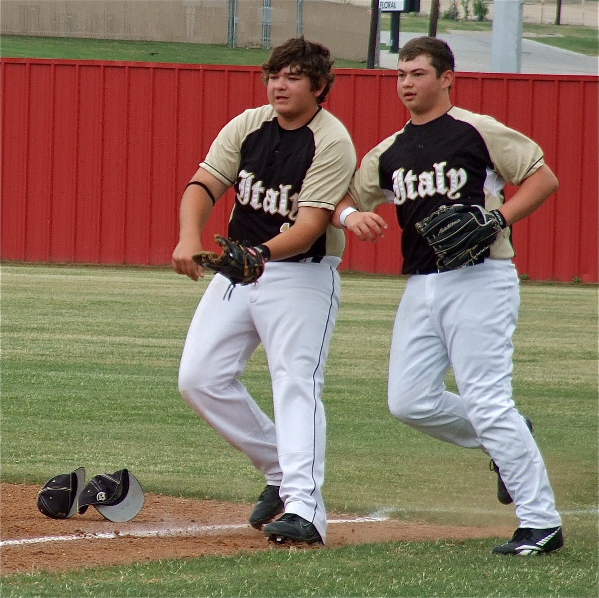 Image: Two hats are better than one. Kevin Roldan(16), and, Zain Byers(10), team up trying to make a play.