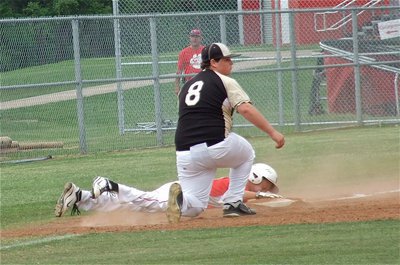 Image: JV Gladiator third baseman, John Byers(8), tags another Tiger out trying to steal his base.