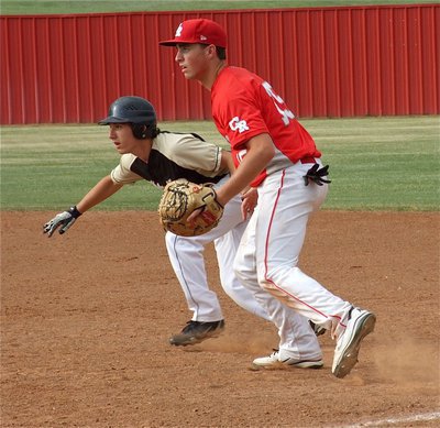 Image: Chace McGinnis(2), tries to sneak to second base for the JV Gladiators.