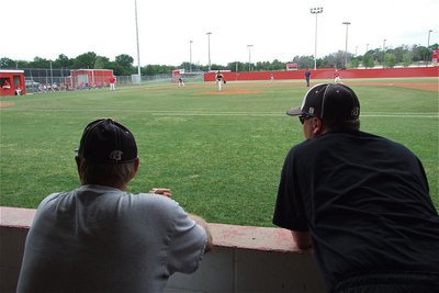 Image: Coach Randy Parks and Coach Josh Ward keep their hats on the action.