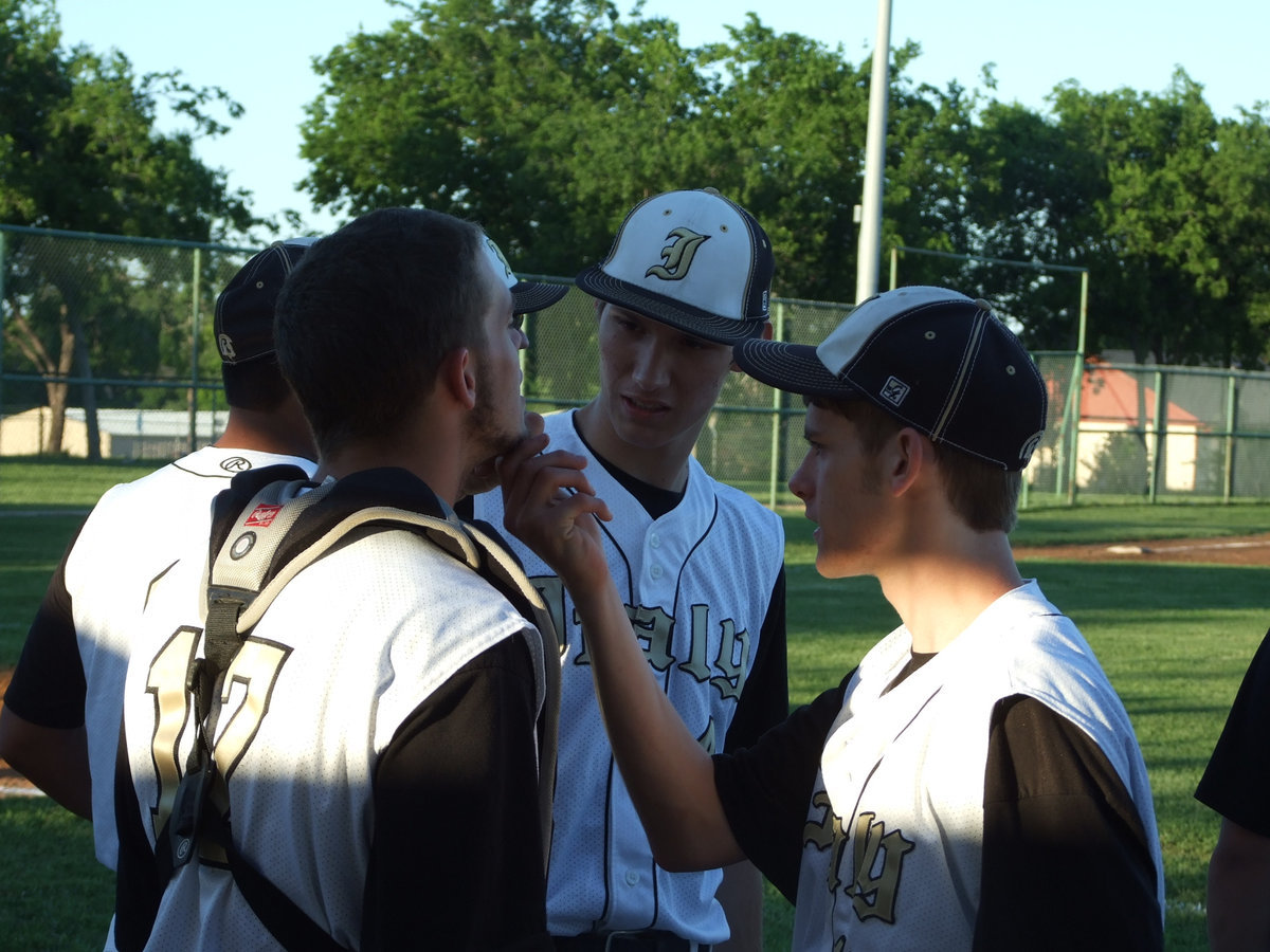 Image: Justin Wood and Alex DeMoss check Brandon Souder’s beard.