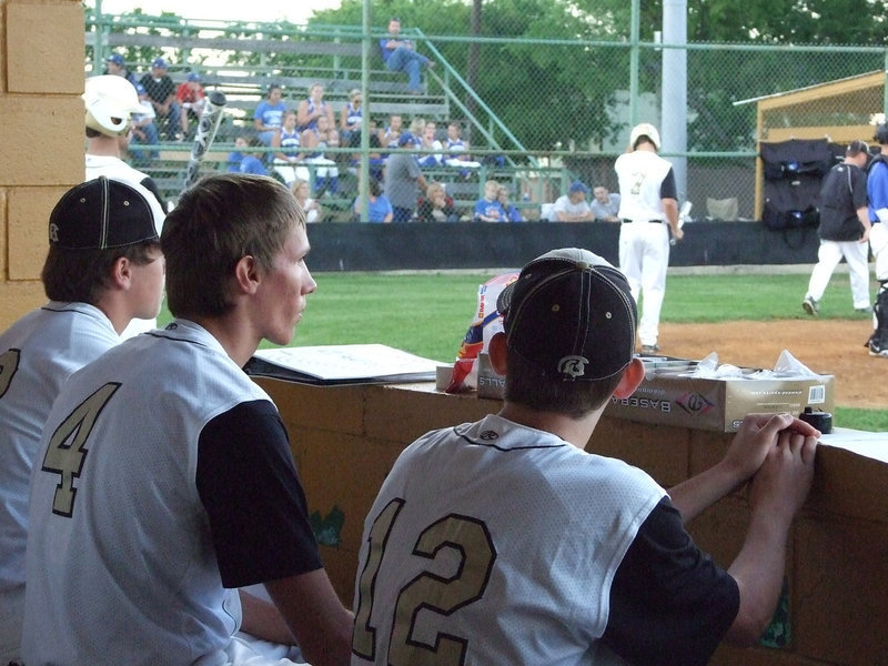 Image: Justin Buchanan, Alex DeMoss and Justin Wood wait their turn to bat.