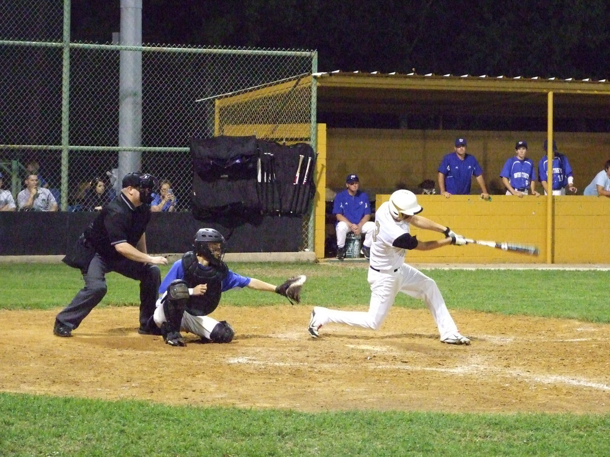 Image: Jase Holden hits one down third baseline.