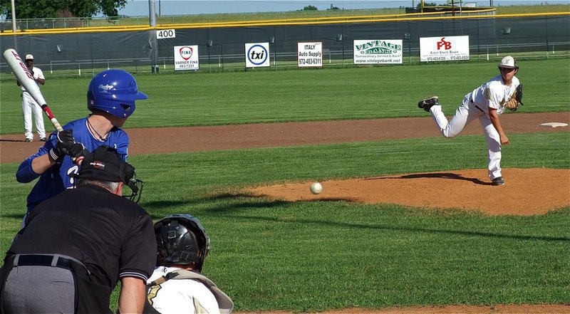 Image: JV Gladiator pitcher, Tyler Anderson, throws a strike to catcher, John Escamilla, during their team’s matchup against Whitney.