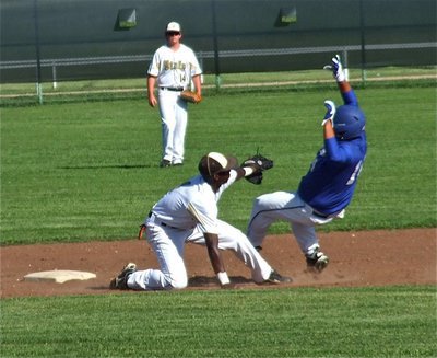 Image: Italy shortstop, Marvin Cox(1), tags out a Wildcat trying to still second base during the JV game.
