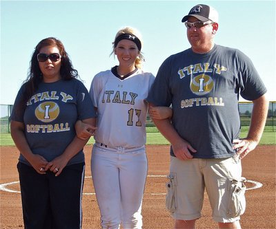 Image: Senior Lady Gladiator, Megan Richards(17), is honored before her final home game with parents, Tina &amp; Allen Richards. “Rich,” wears the number 17 as a tribute to her father who donned the number back in the day.
