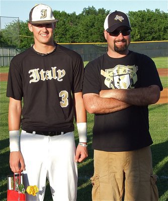 Image: Senior Gladiator, Jase Holden(3), is honored during, “Senior Day,” and stands with his father, Shawn Holden.
