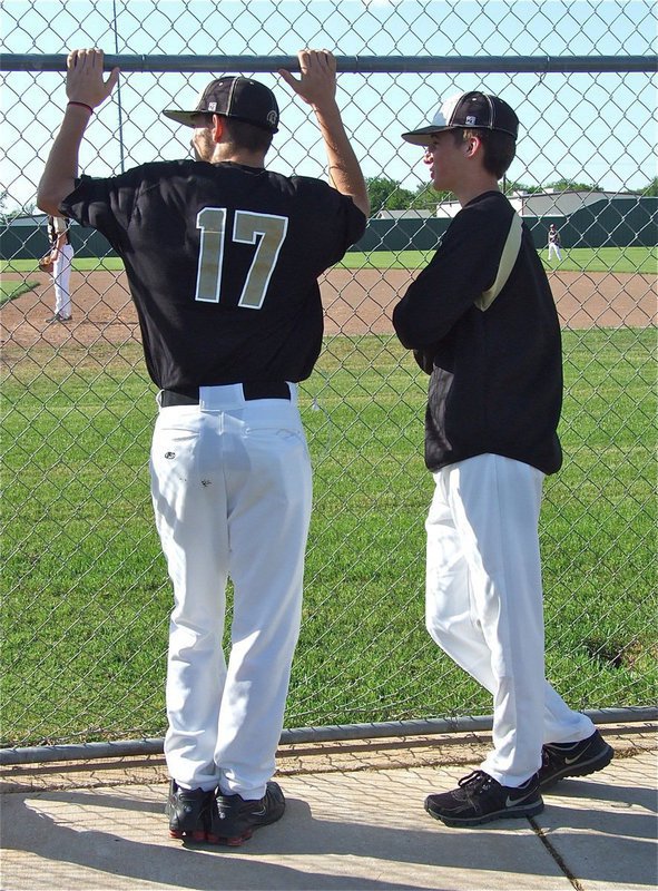 Image: Gladiator seniors, Brandon Souder(17) and Ross Stiles(1) checkout the JV game.