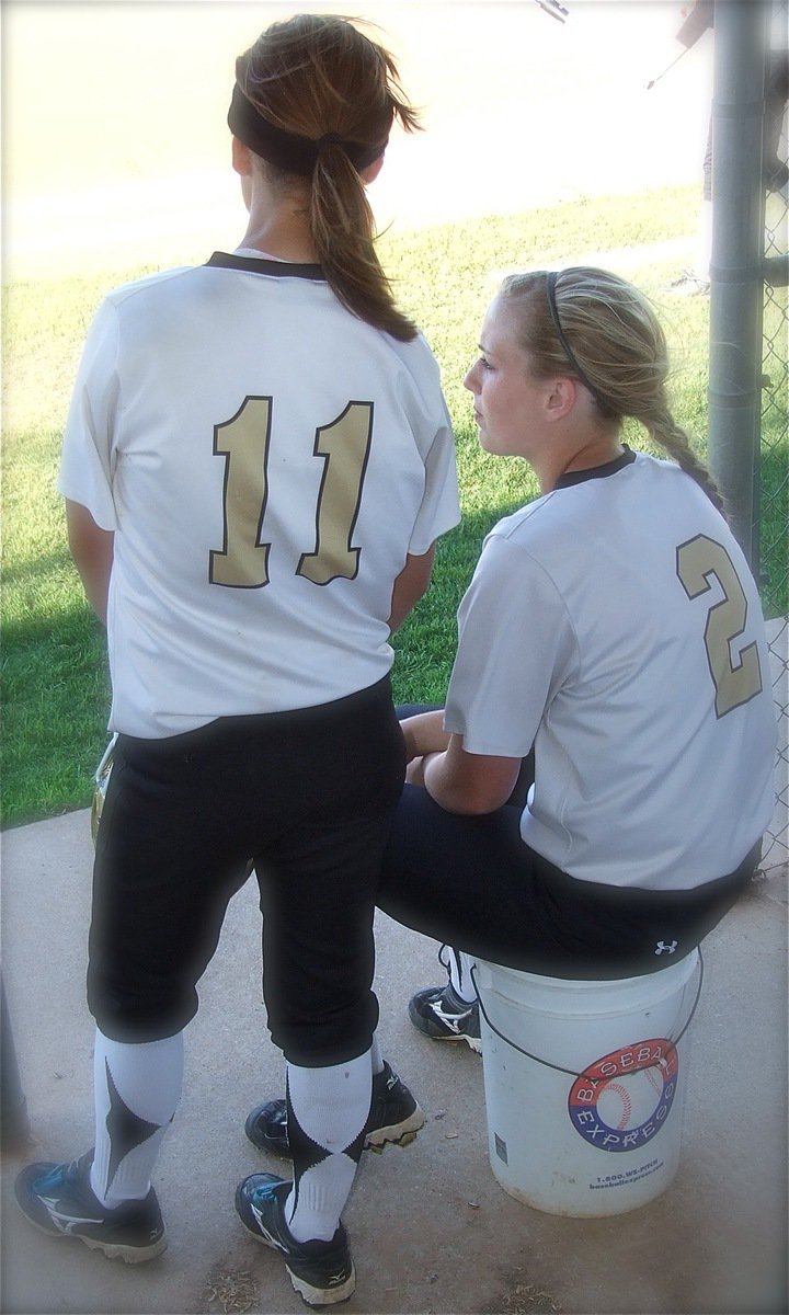 Image: Bailey Eubank(11) and Madison Washington(2) share a moment before the start of their game.