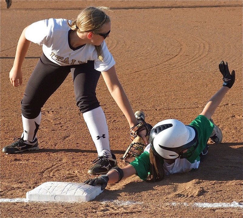 Image: First baseman, Jaclynn Lewis(15) hopes for an out call from the umpire.