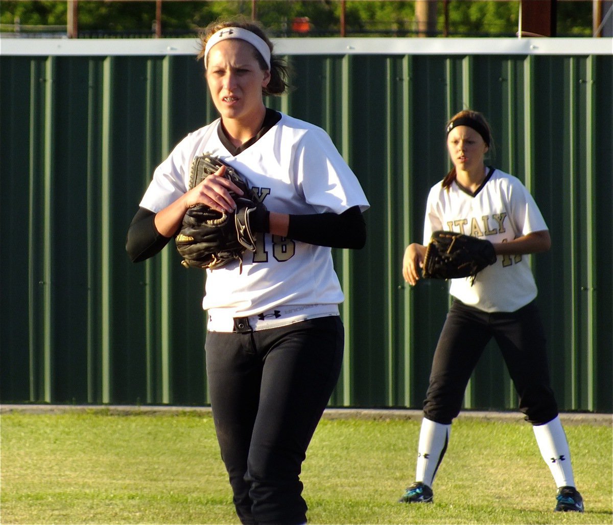 Image: Lady Gladiators, Bailey Bumpus(18) and Bailey Eubank(11) mitt up on defense.